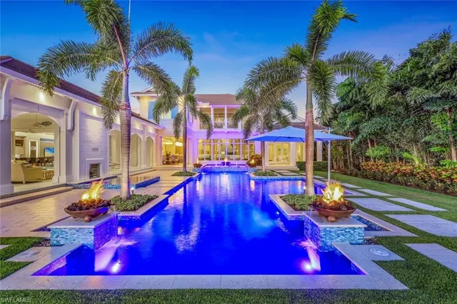 a view of swimming pool with chairs