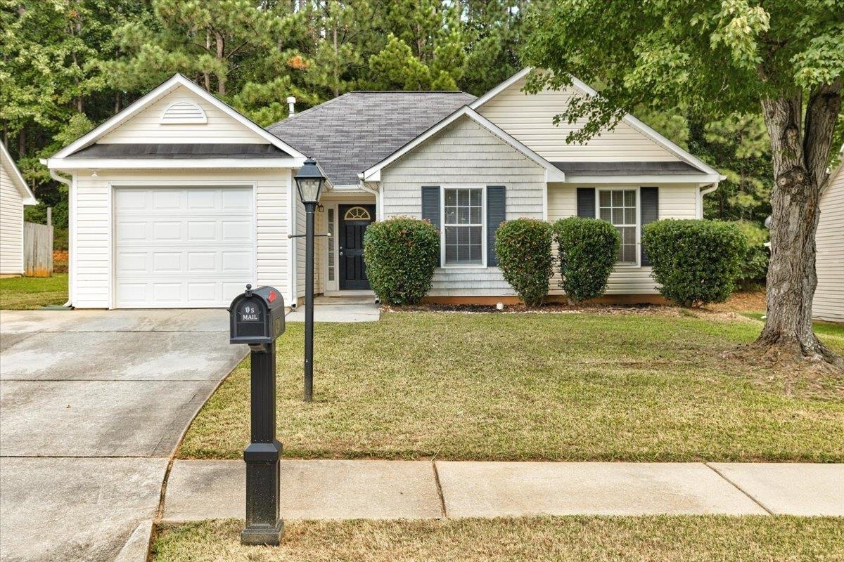 139 Misty Ridge Trail Stockbridge, GA 30281 - Photo 1 of 1 a front view of a house with garden