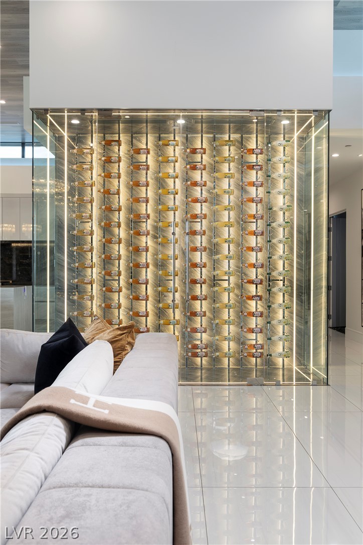 611 Cityview Ridge Drive Henderson, NV 89012 - Photo 15 of 66 Polished tile flooring reflects the dramatic glow of a glass-enclosed custom display.