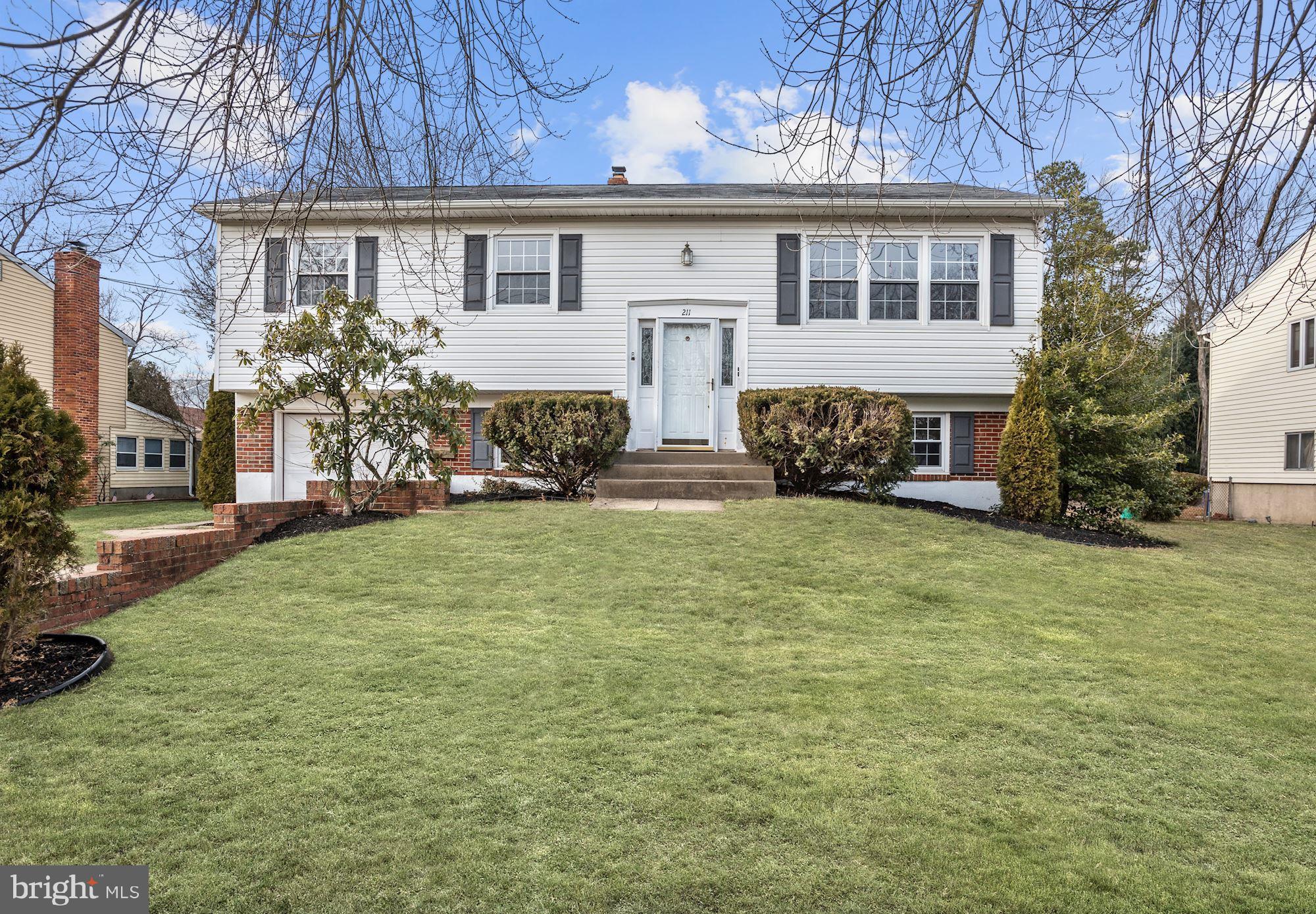 211 Winston Road Mount Laurel, NJ 08054 - Photo 1 of 32 a front view of a house with a yard