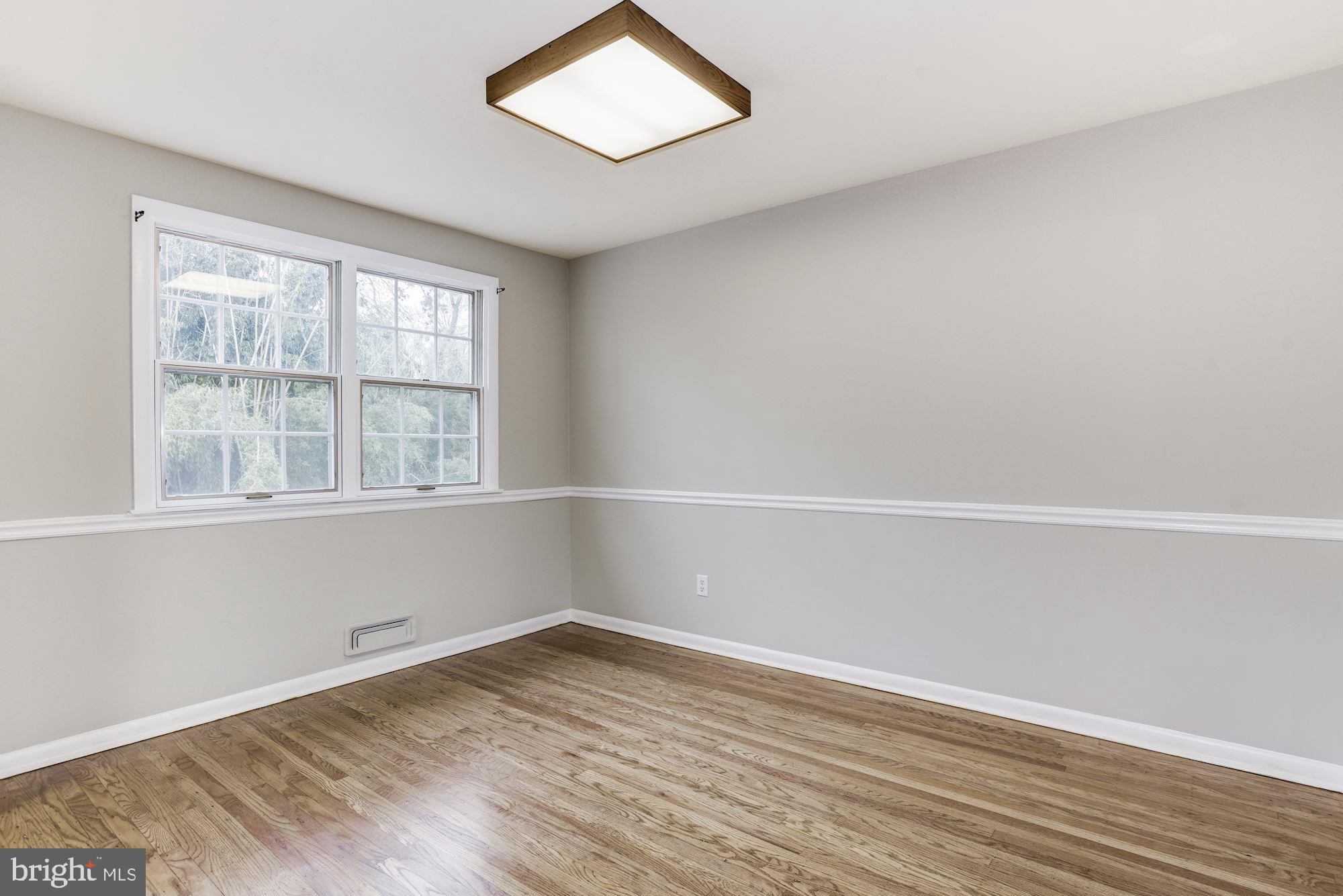 211 Winston Road Mount Laurel, NJ 08054 - Photo 12 of 32 an empty room with wooden floor and windows