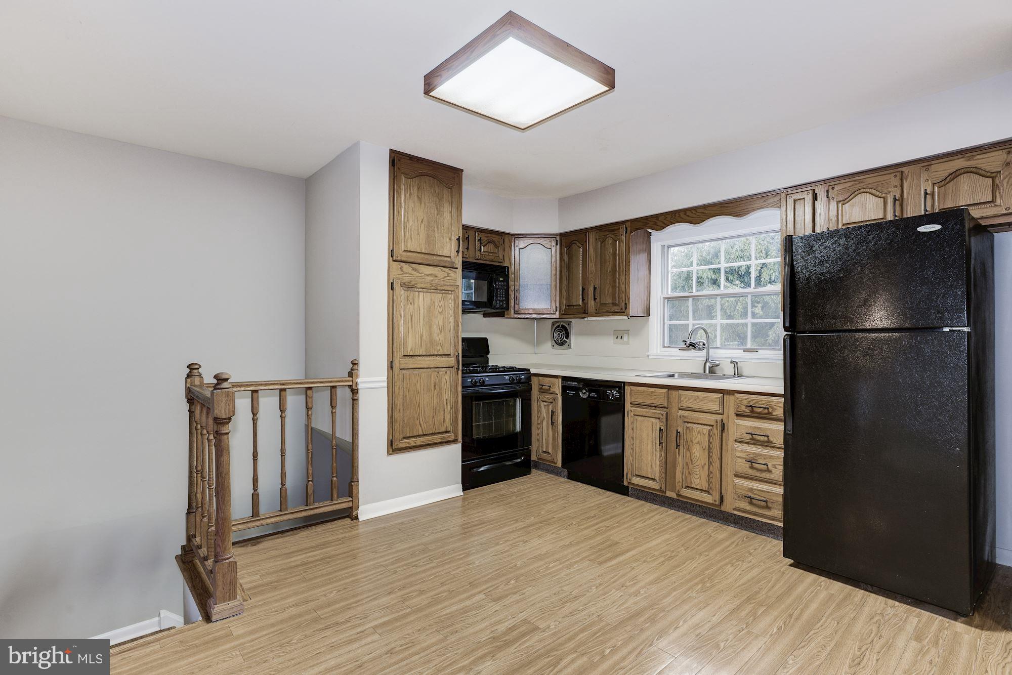 211 Winston Road Mount Laurel, NJ 08054 - Photo 13 of 32 a kitchen with a refrigerator a stove top oven a sink and dishwasher