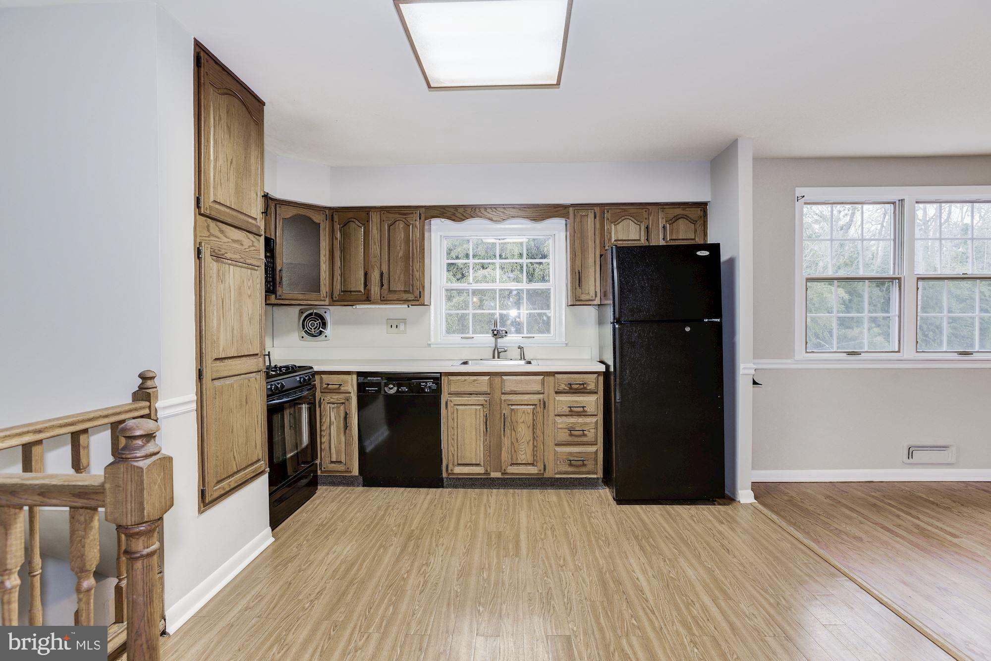 211 Winston Road Mount Laurel, NJ 08054 - Photo 14 of 32 a kitchen with a refrigerator and a stove top oven