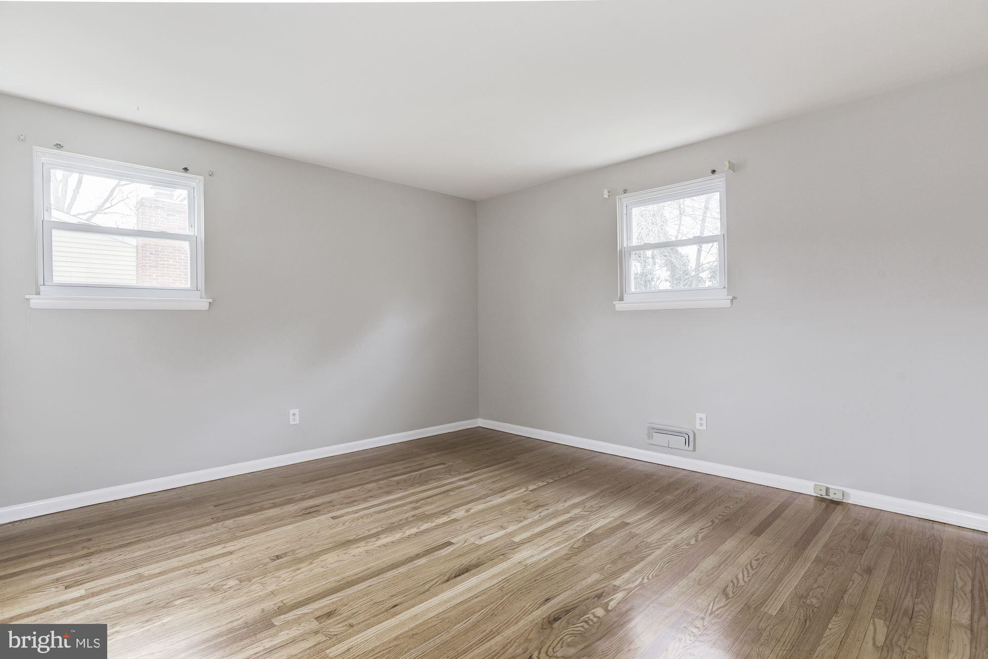 211 Winston Road Mount Laurel, NJ 08054 - Photo 16 of 32 wooden floor in an empty room with a window