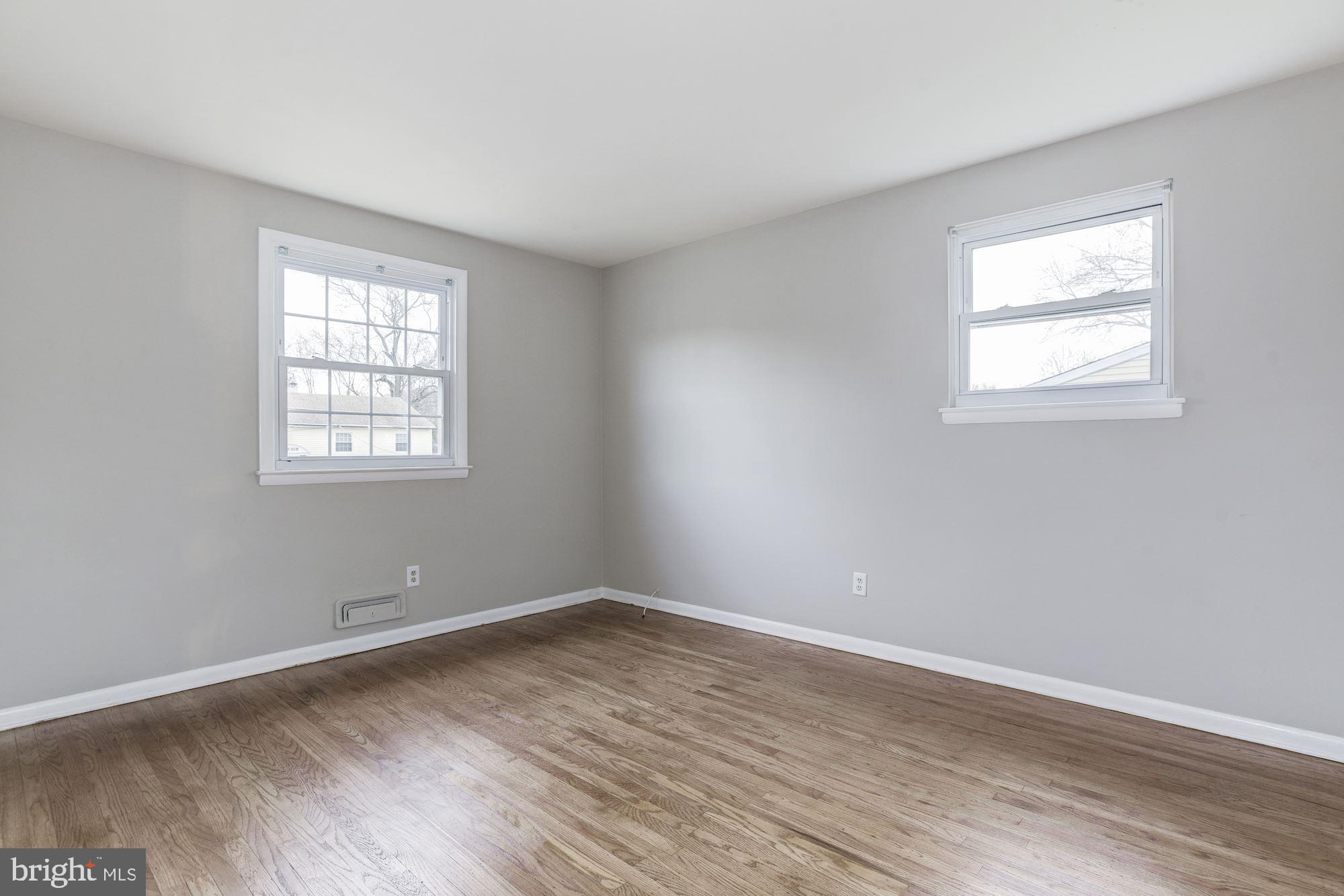 211 Winston Road Mount Laurel, NJ 08054 - Photo 19 of 32 wooden floor in an empty room with a window