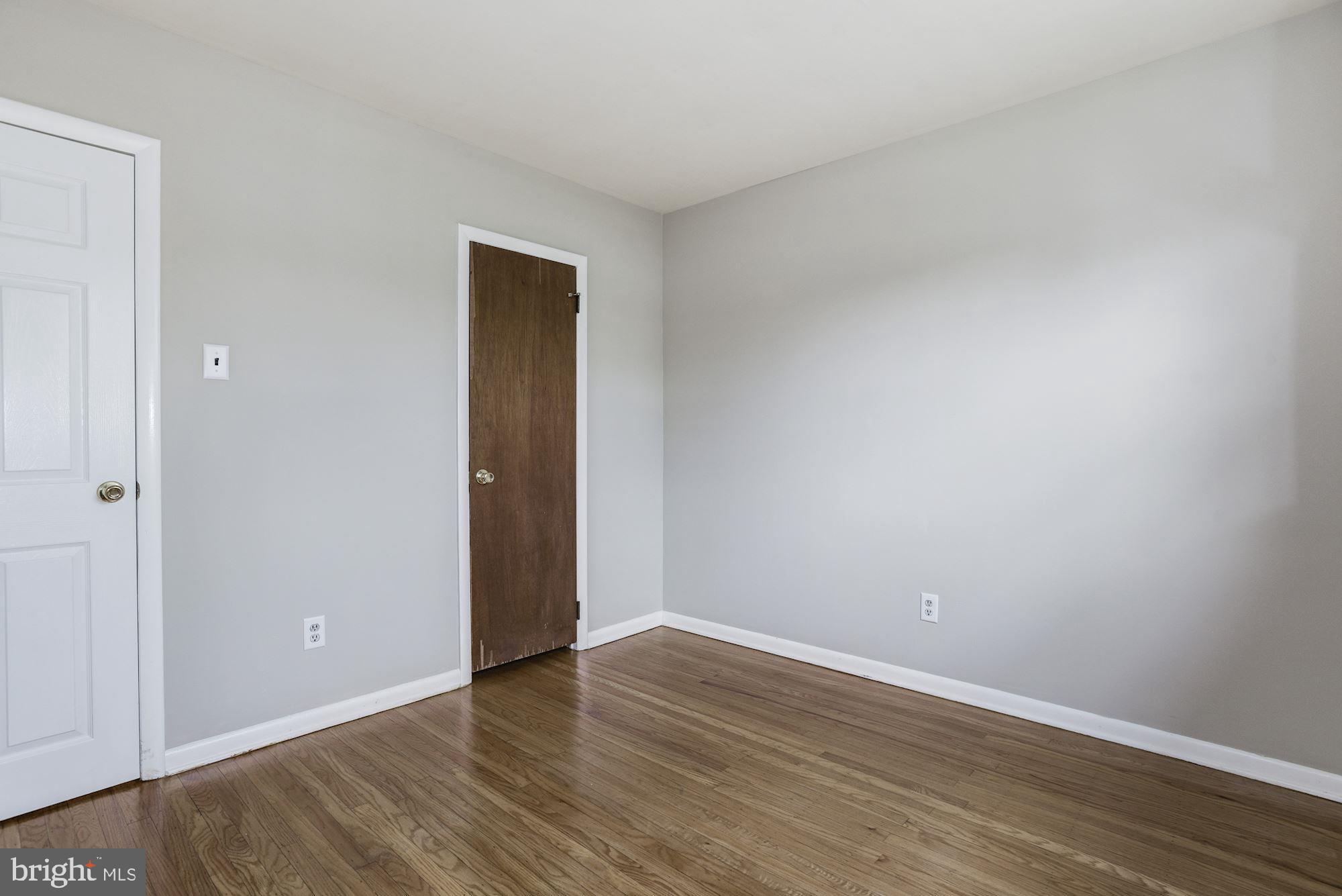 211 Winston Road Mount Laurel, NJ 08054 - Photo 22 of 32 a view of an empty room with wooden floor and closet