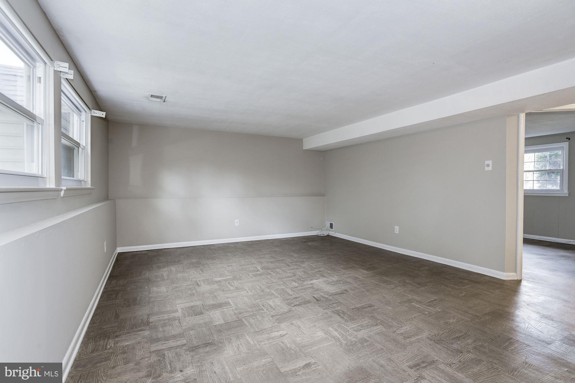 211 Winston Road Mount Laurel, NJ 08054 - Photo 29 of 32 wooden floor in an empty room with a window