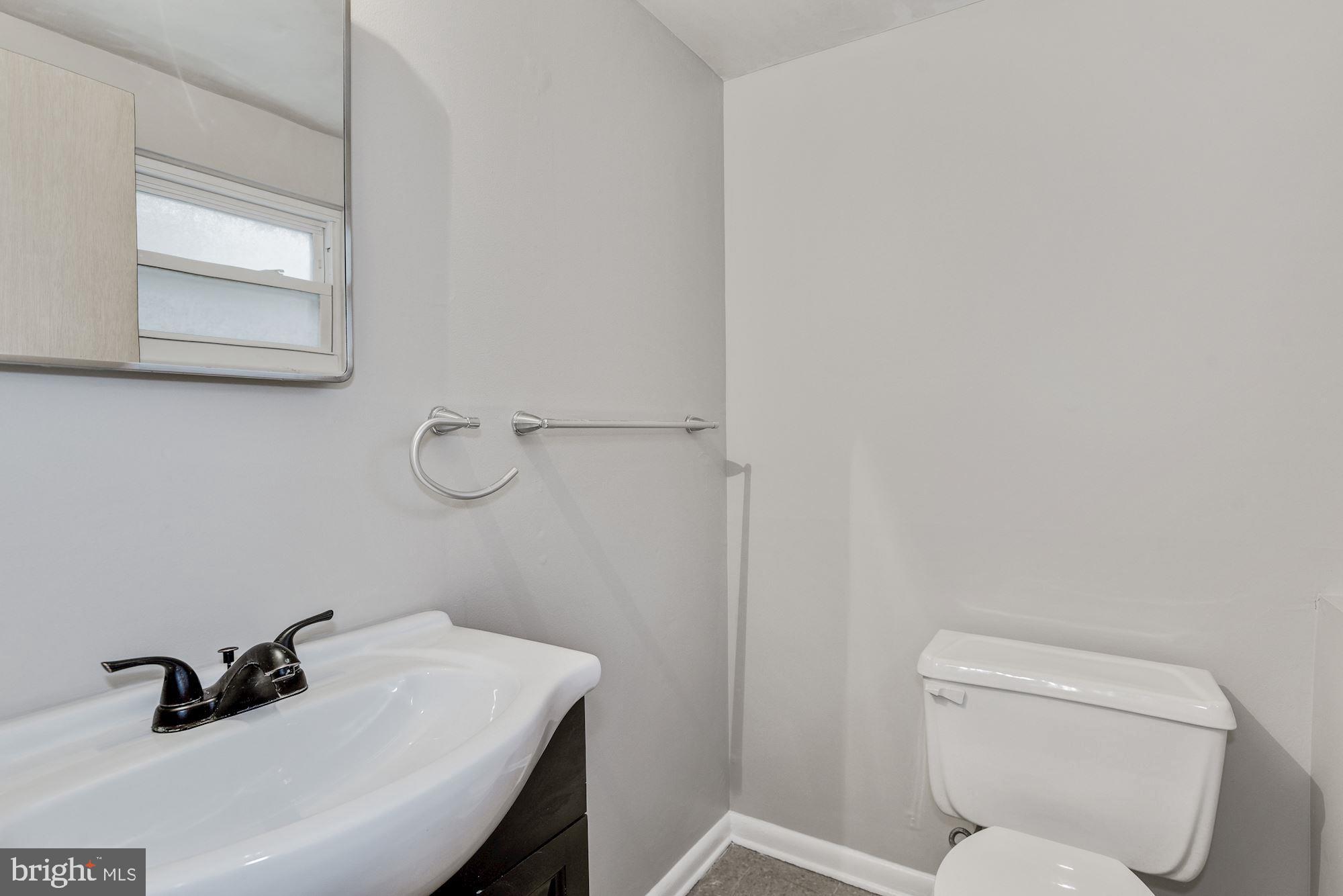 211 Winston Road Mount Laurel, NJ 08054 - Photo 31 of 32 a bathroom with a sink toilet and vanity