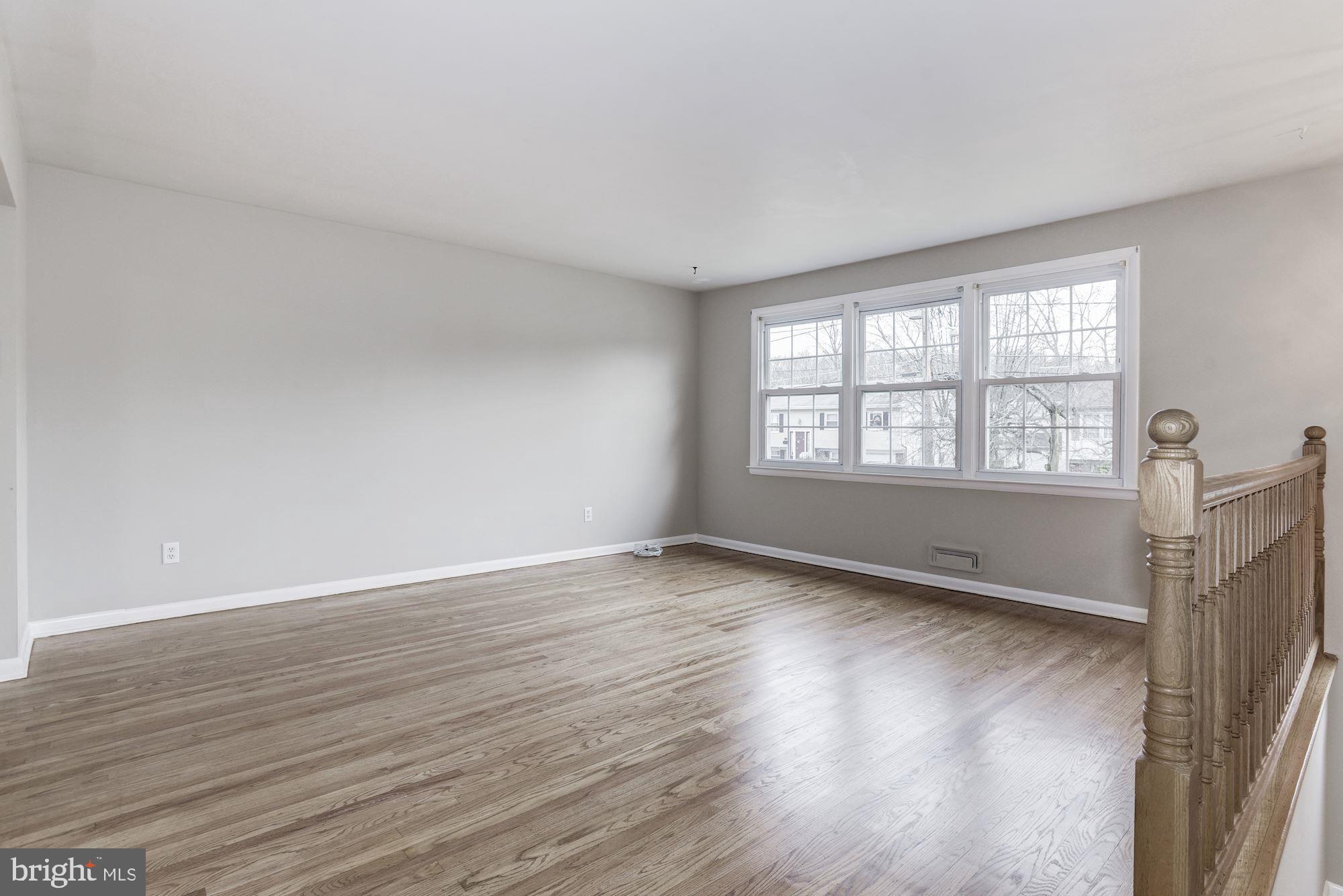211 Winston Road Mount Laurel, NJ 08054 - Photo 5 of 32 a view of an empty room with wooden floor and a window