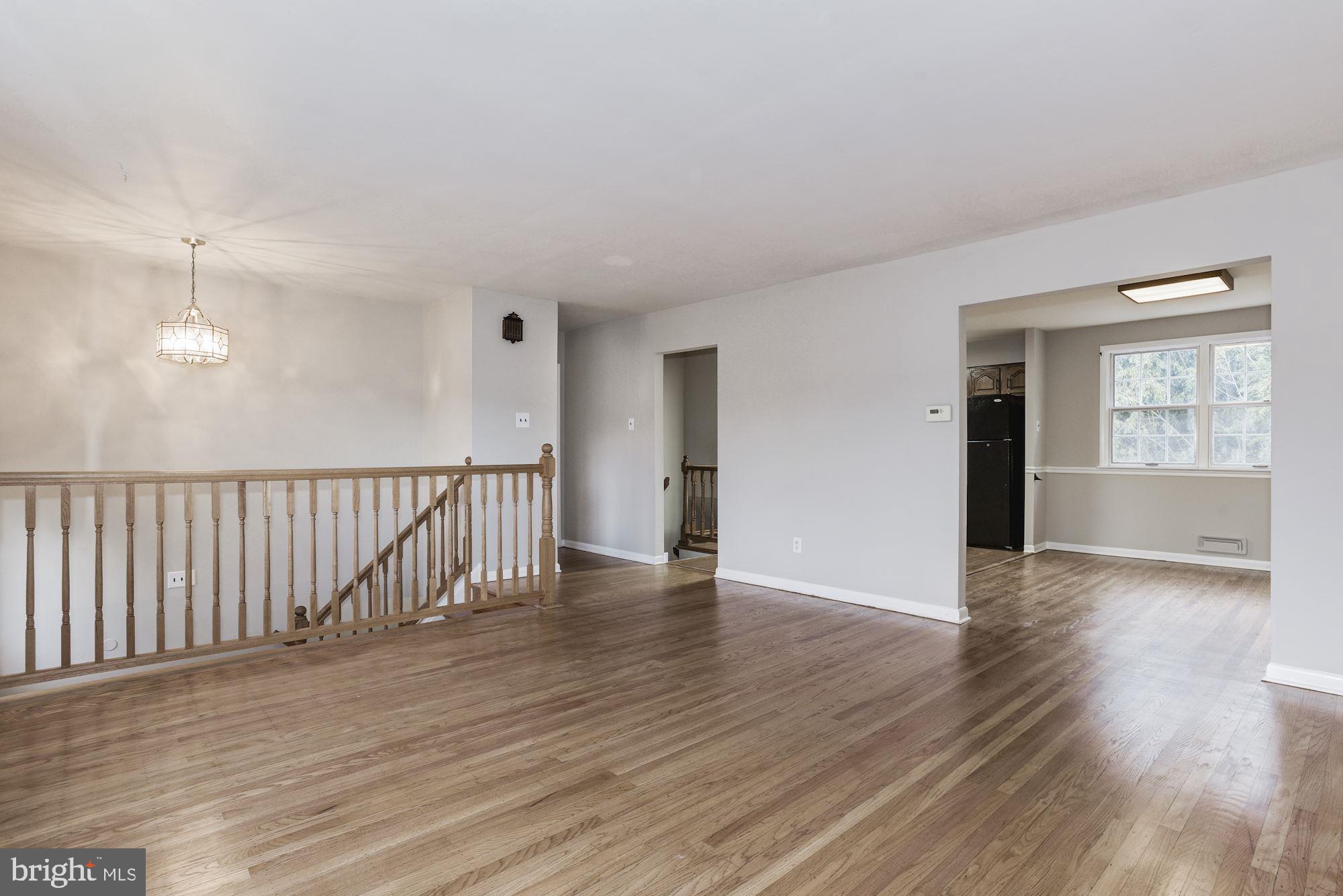 211 Winston Road Mount Laurel, NJ 08054 - Photo 7 of 32 a view of an empty room with wooden floor and a window