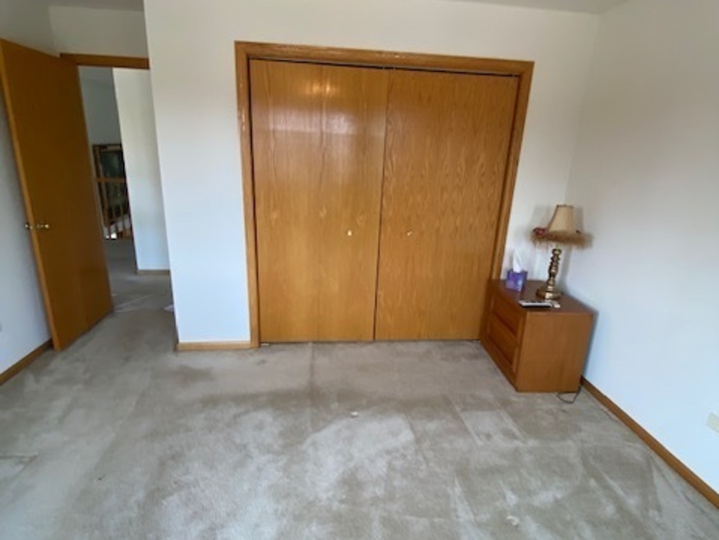Undisclosed Address Olympia Fields, IL 60461 - Photo 23 of 31 an empty room with wooden floor and closet