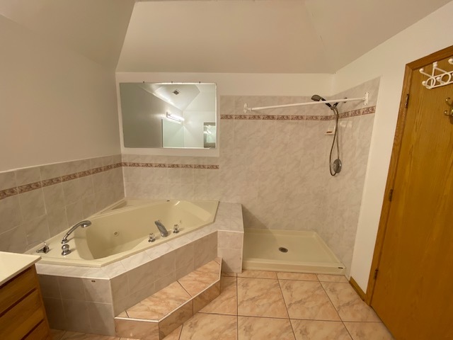 Undisclosed Address Olympia Fields, IL 60461 - Photo 27 of 31 a bathroom with a bathtub and shower