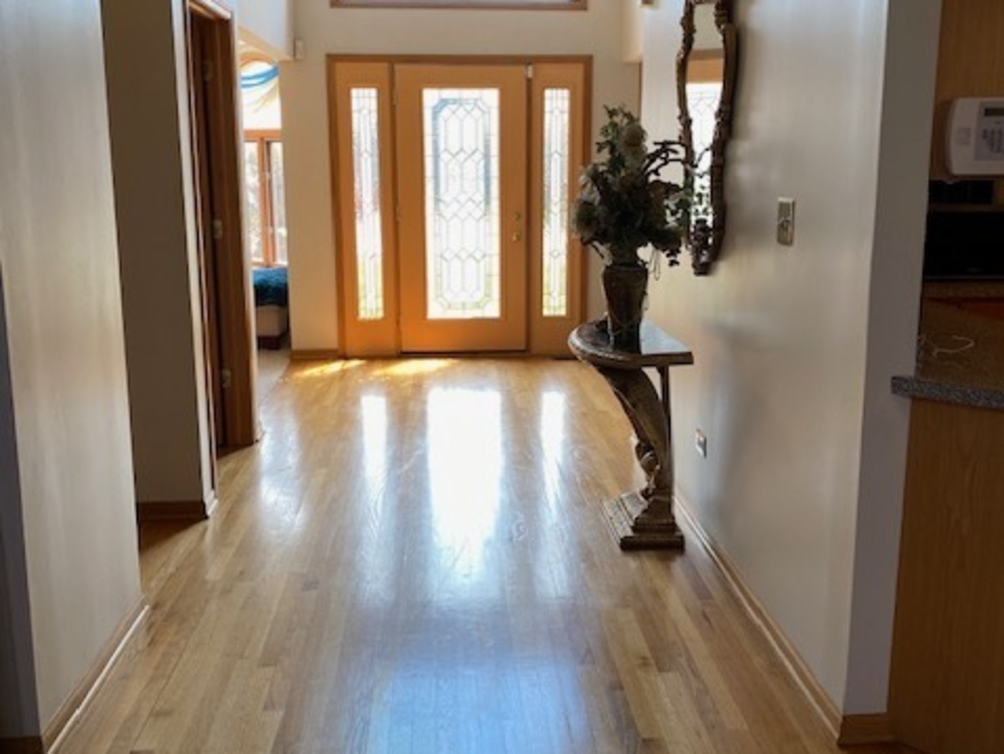 Undisclosed Address Olympia Fields, IL 60461 - Photo 4 of 31 a view of hallway with wooden floor and stairs