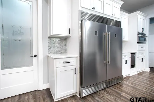 a bathroom with a shower and a glass door