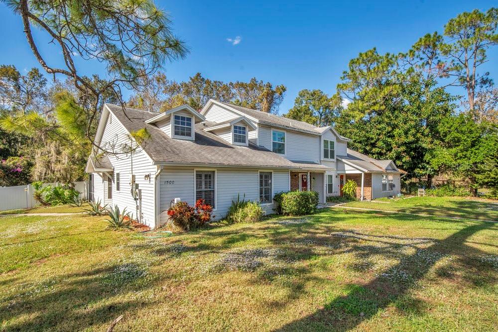 a front view of house with an outdoor space and seating