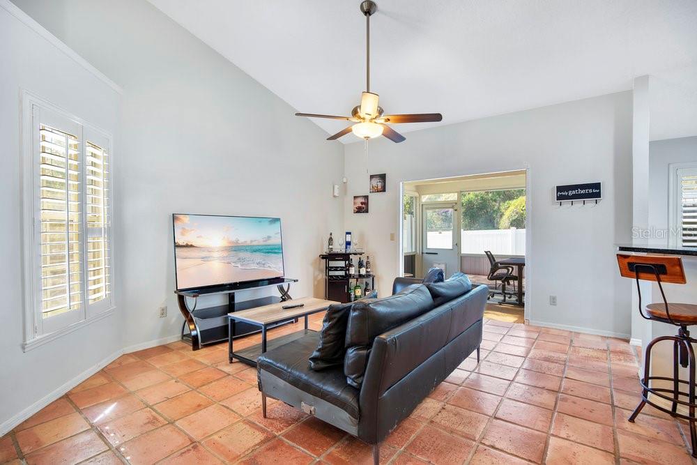 1500 Rivers Edge Drive Orlando, FL 32825 - Photo 7 of 33 a living room with furniture a flat screen tv and a window