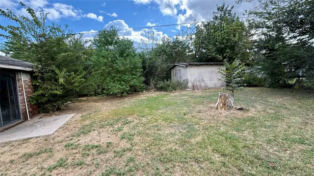 a backyard of a house with lots of green space