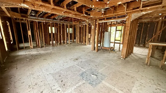 a close view of a bathroom with shower and curtain