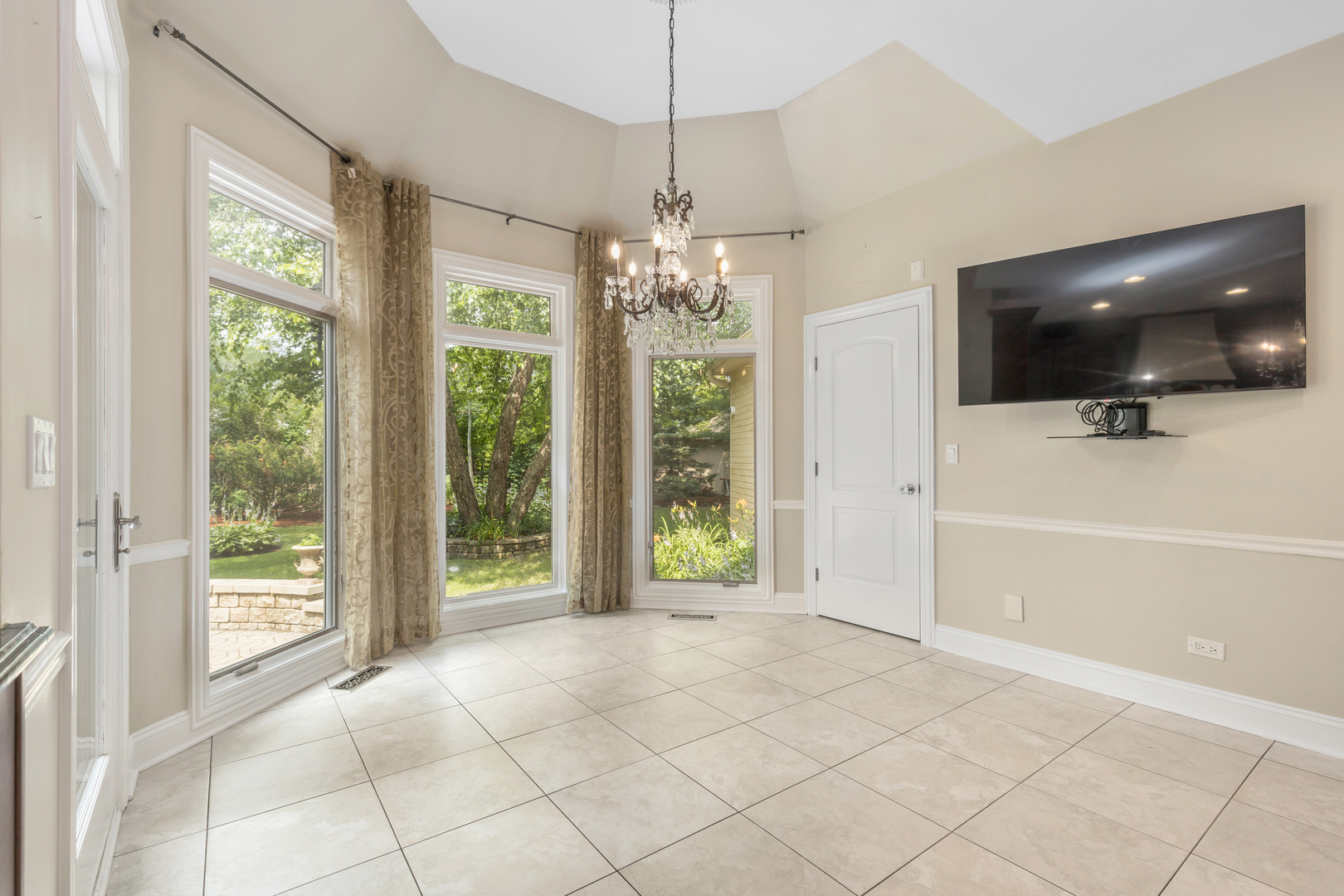 238 Linden Road Northbrook, IL 60062 - Photo 12 of 51 a view of an empty room with window and chandelier