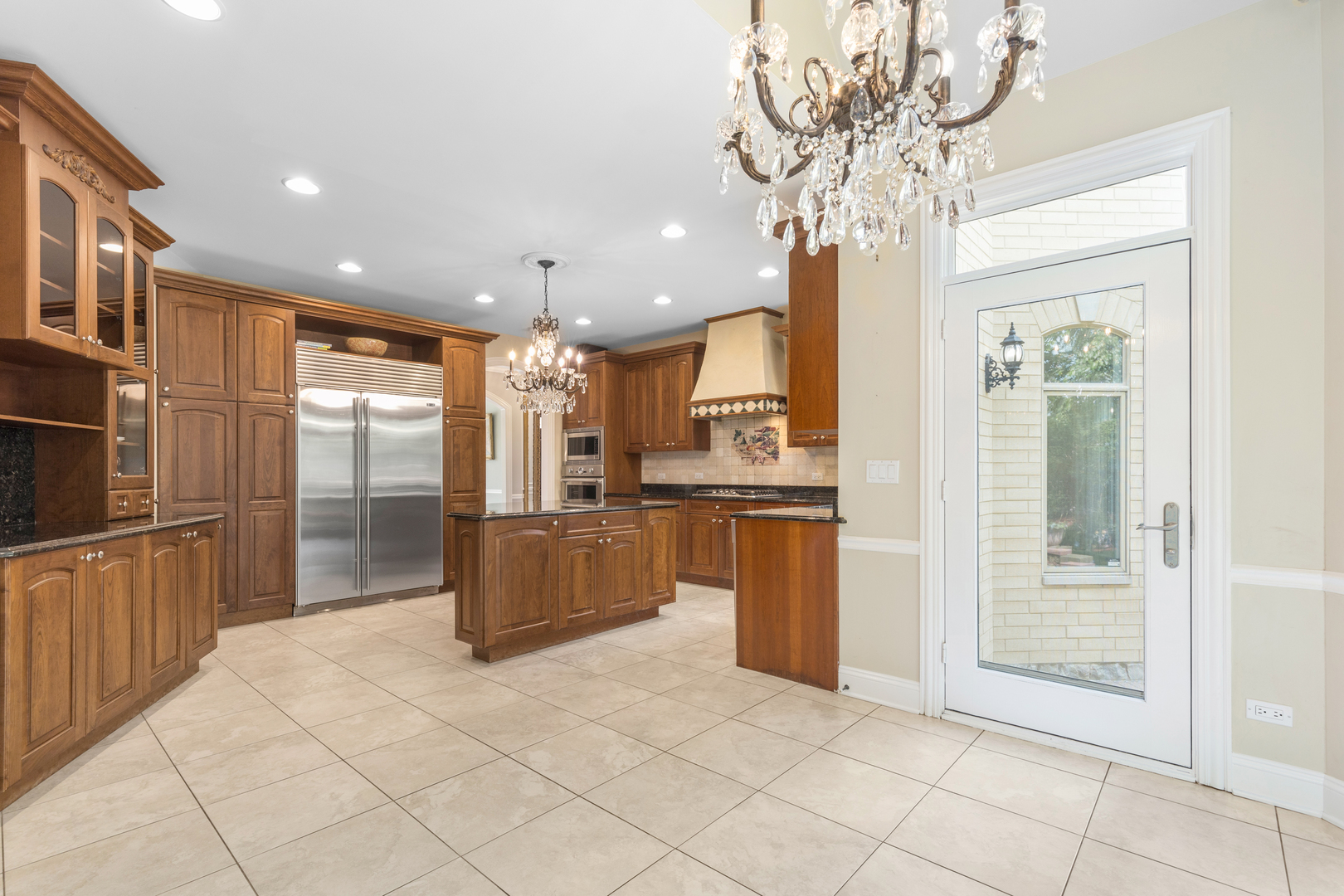 238 Linden Road Northbrook, IL 60062 - Photo 13 of 51 a kitchen with stainless steel appliances granite countertop a refrigerator a sink a stove and oven