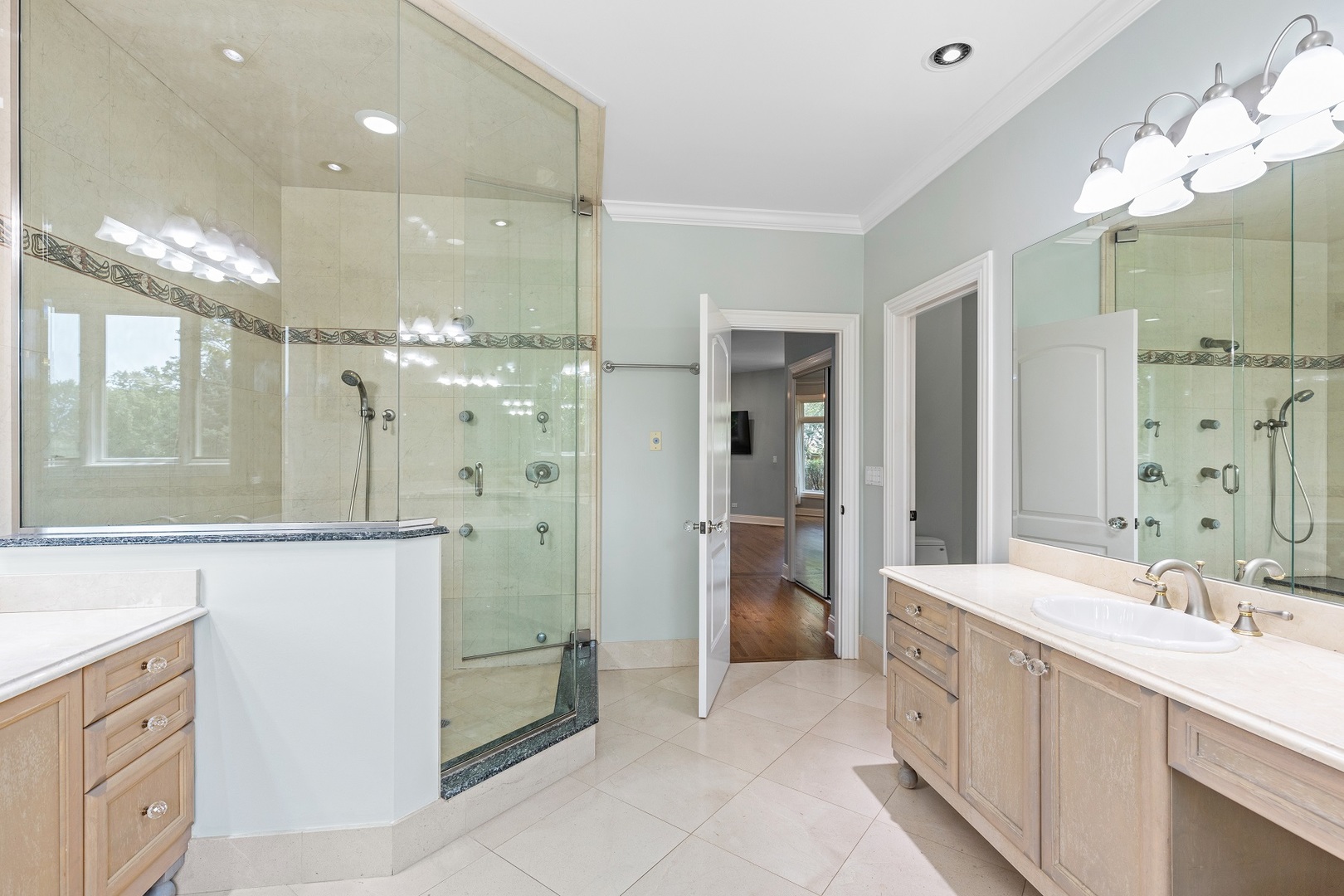238 Linden Road Northbrook, IL 60062 - Photo 17 of 51 a bathroom with a double vanity sink mirror and shower