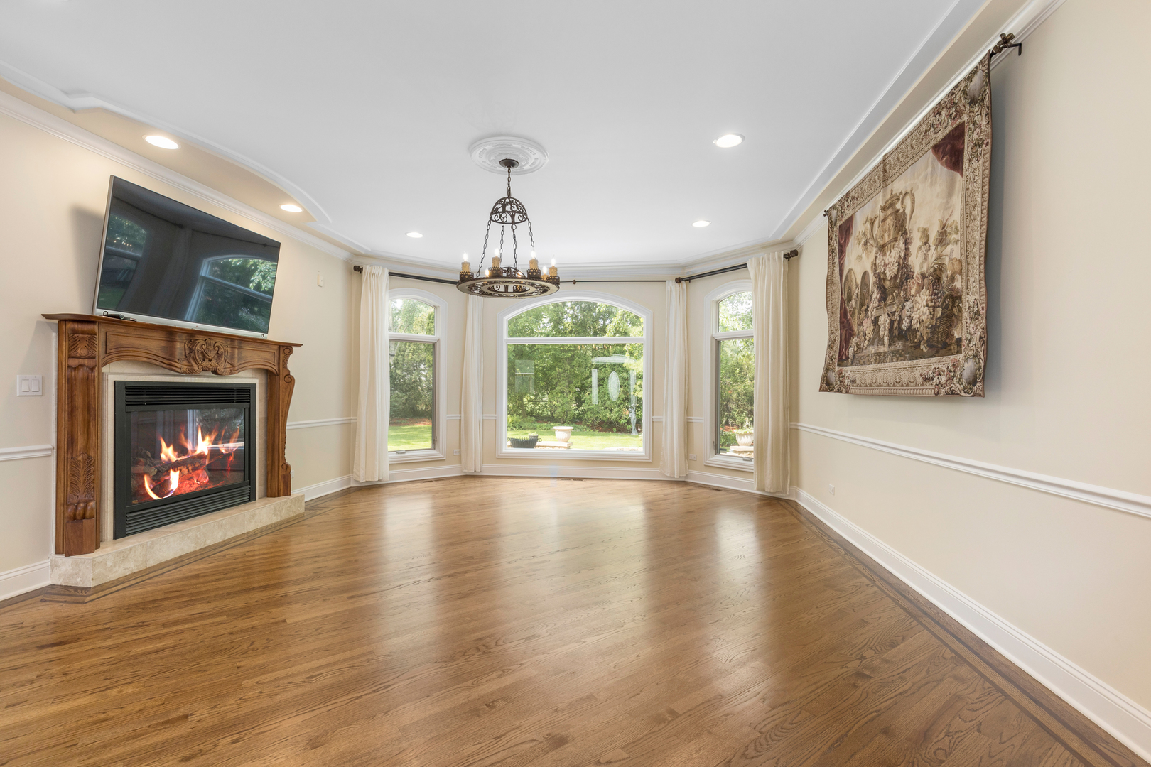 238 Linden Road Northbrook, IL 60062 - Photo 3 of 51 a view of an empty room with wooden floor fireplace and a window