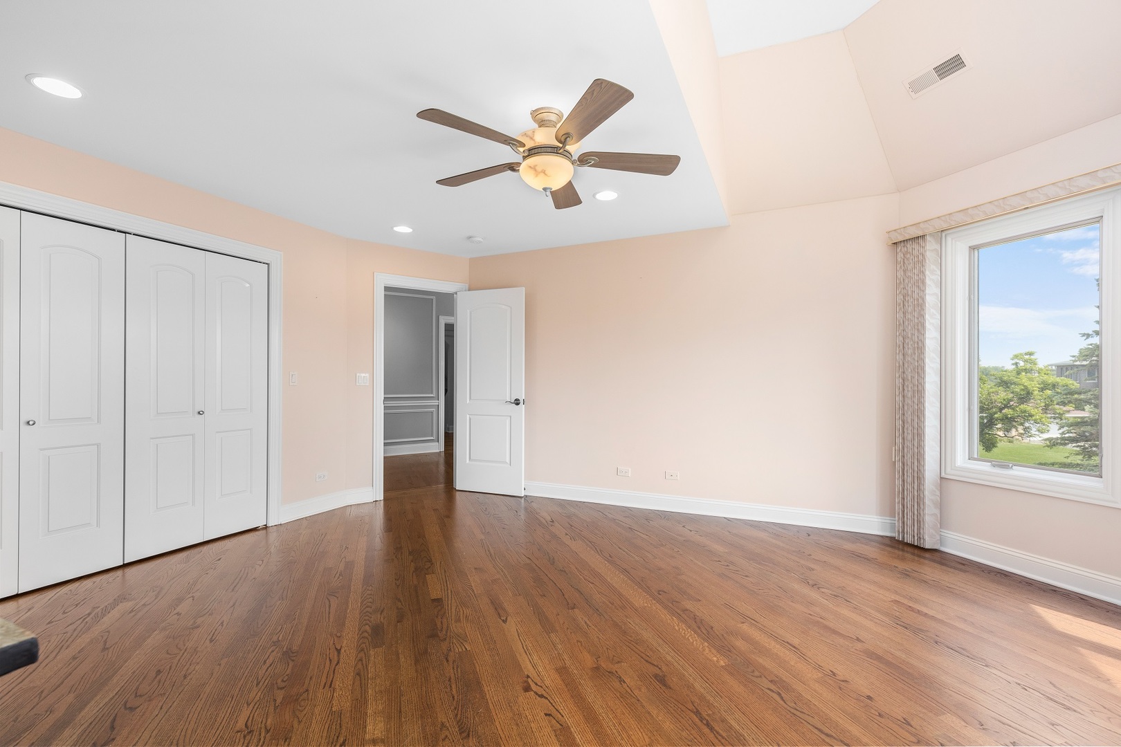 238 Linden Road Northbrook, IL 60062 - Photo 24 of 51 a view of an empty room with wooden floor and a window