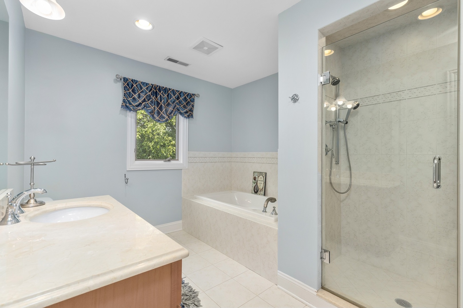 238 Linden Road Northbrook, IL 60062 - Photo 28 of 51 a bathroom with a sink a shower and a mirror