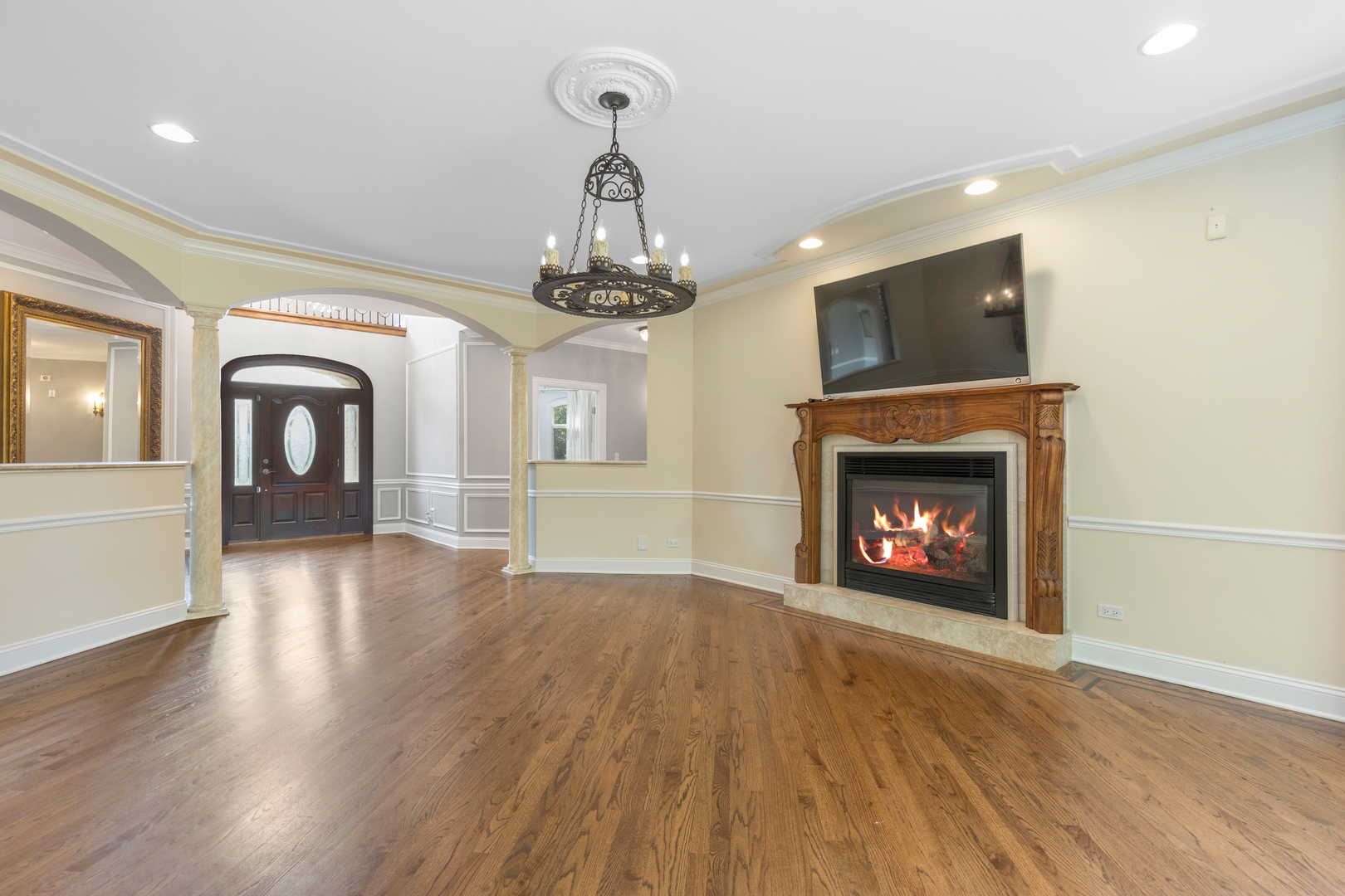 238 Linden Road Northbrook, IL 60062 - Photo 4 of 51 a view of an empty room with wooden floor fireplace and a window