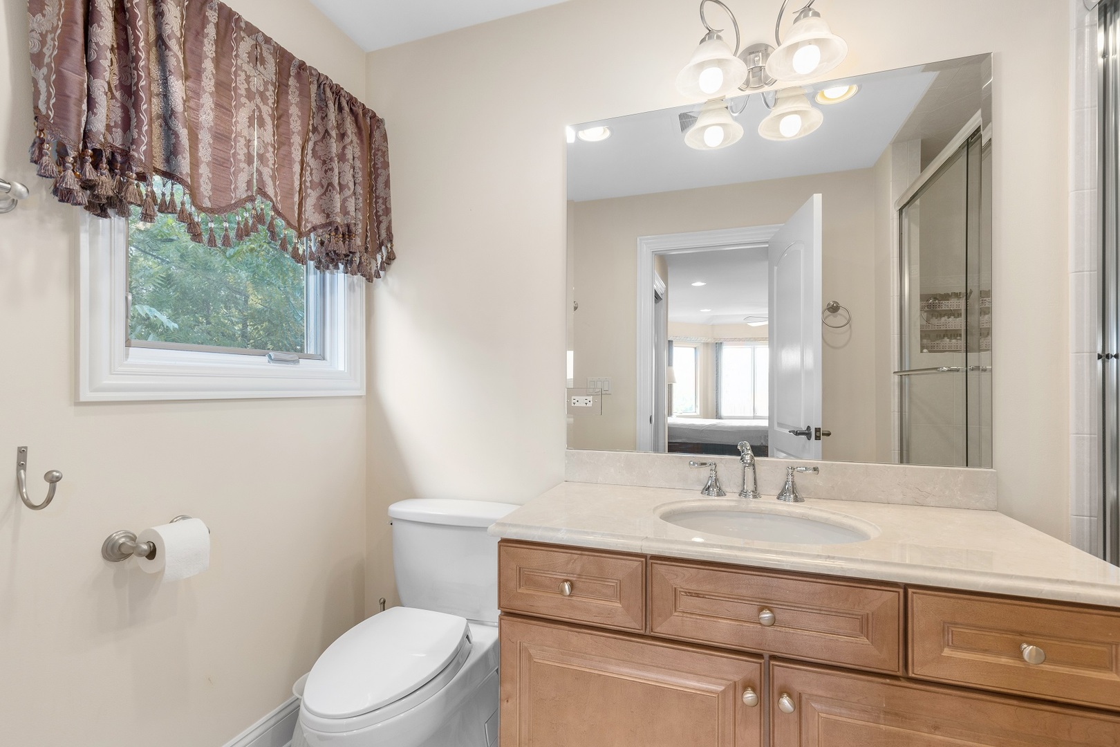 238 Linden Road Northbrook, IL 60062 - Photo 32 of 51 a bathroom with a sink a toilet and a mirror