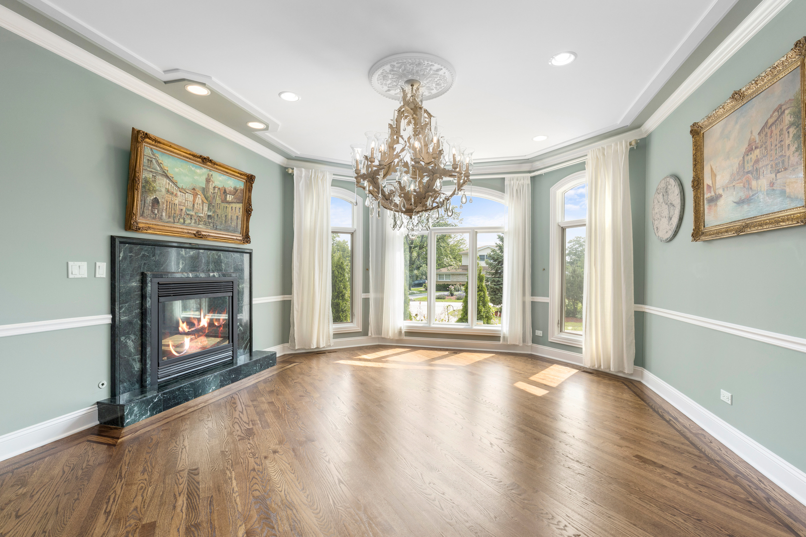 238 Linden Road Northbrook, IL 60062 - Photo 5 of 51 a view of an empty room with wooden floor fireplace and a window