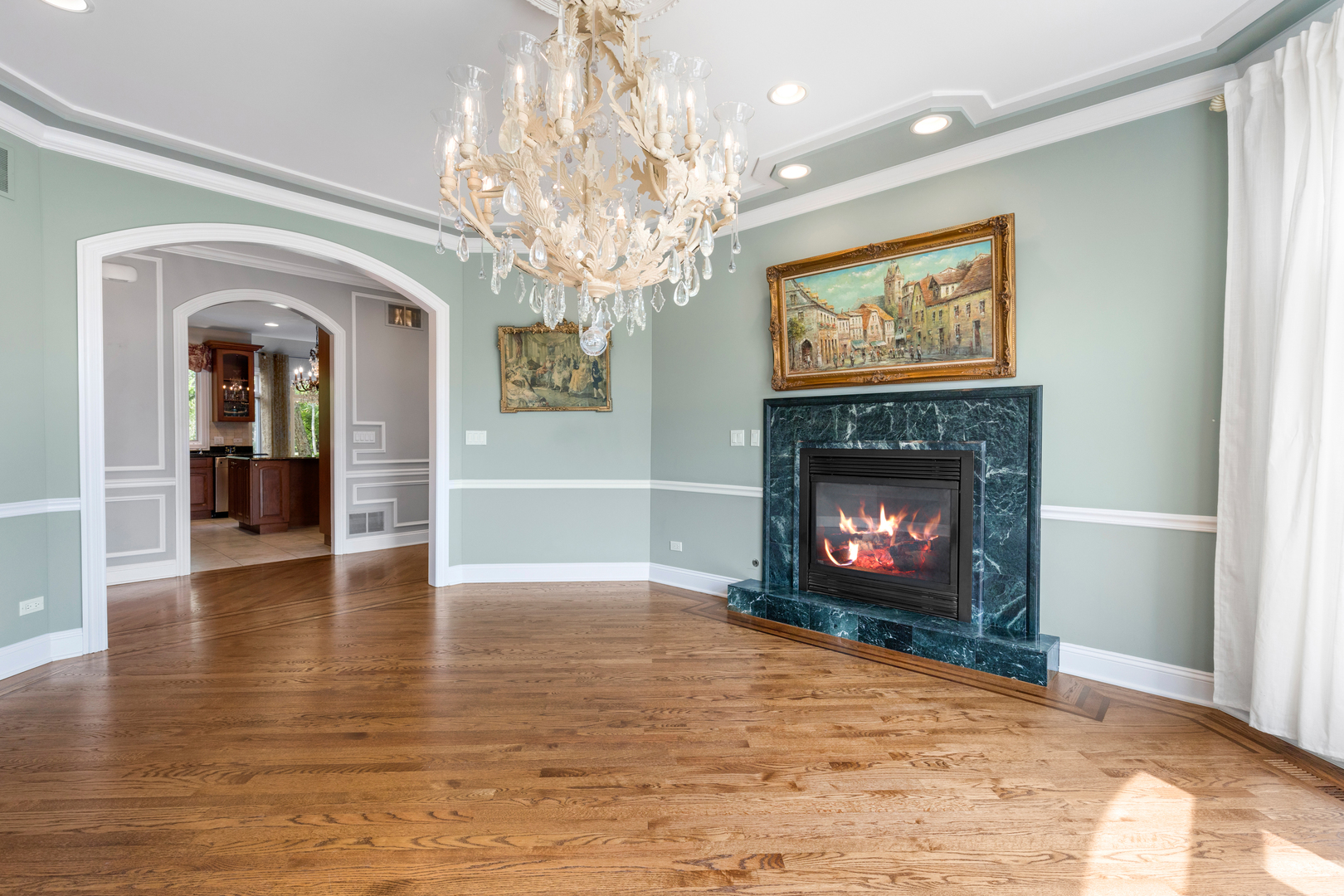 238 Linden Road Northbrook, IL 60062 - Photo 6 of 51 a view of a livingroom with a fireplace a fireplace and wooden floor