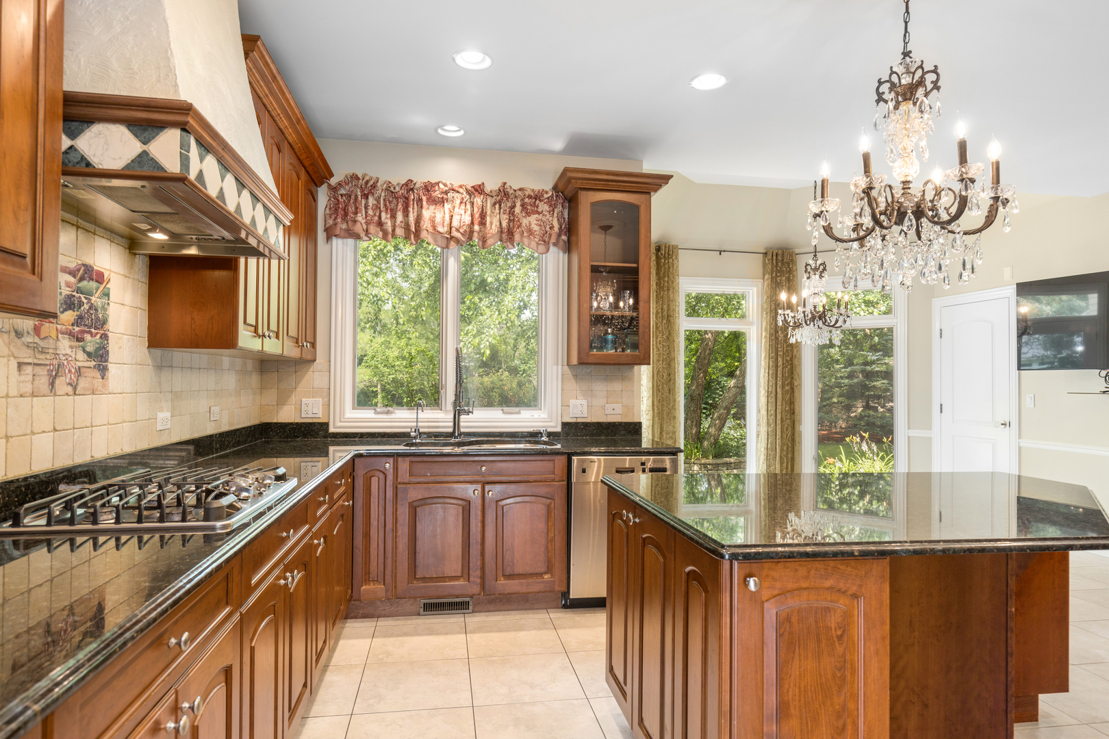 238 Linden Road Northbrook, IL 60062 - Photo 7 of 51 a kitchen with stainless steel appliances granite countertop a stove and a sink