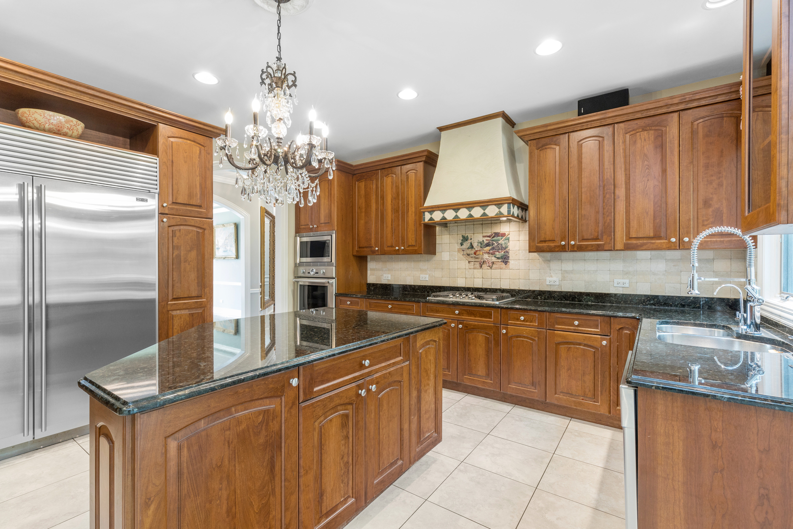 238 Linden Road Northbrook, IL 60062 - Photo 8 of 51 a kitchen with stainless steel appliances granite countertop a sink refrigerator and cabinets