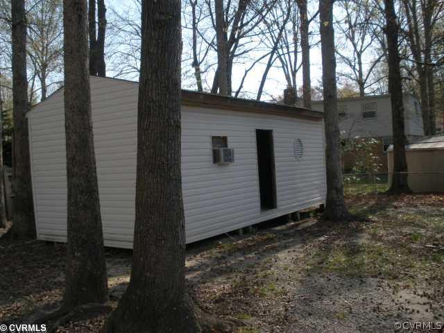 11100 Robious Road Richmond, VA 23235 - Photo 2 of 3 a view of a house with a yard