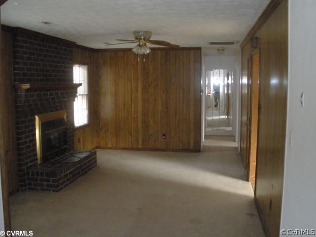 11100 Robious Road Richmond, VA 23235 - Photo 3 of 3 a view of an empty room with a fireplace
