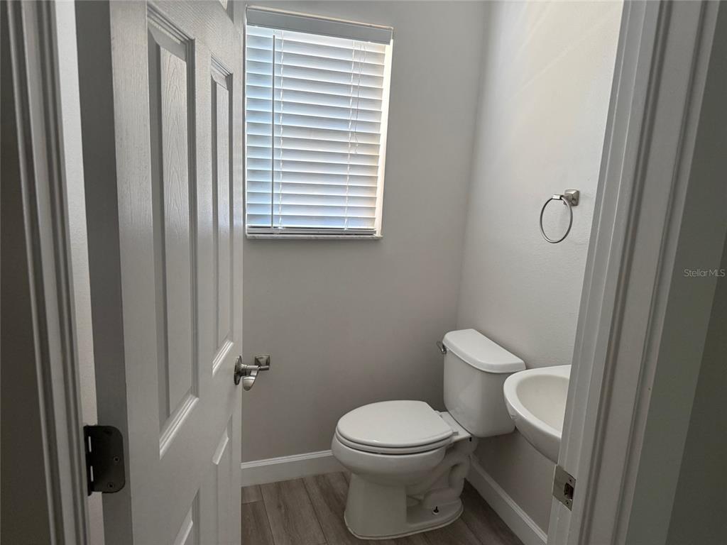 7350 Black Walnut Way Lakewood Ranch, FL 34202 - Photo 22 of 52 a white toilet sitting next to a bathroom sink