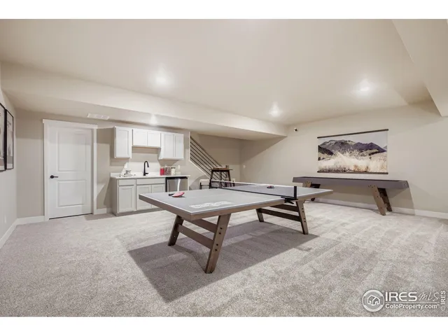 a living room with furniture and a rug