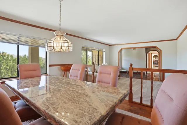 a living room with furniture and large window