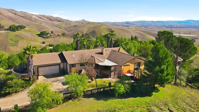 an aerial view of a house with a garden