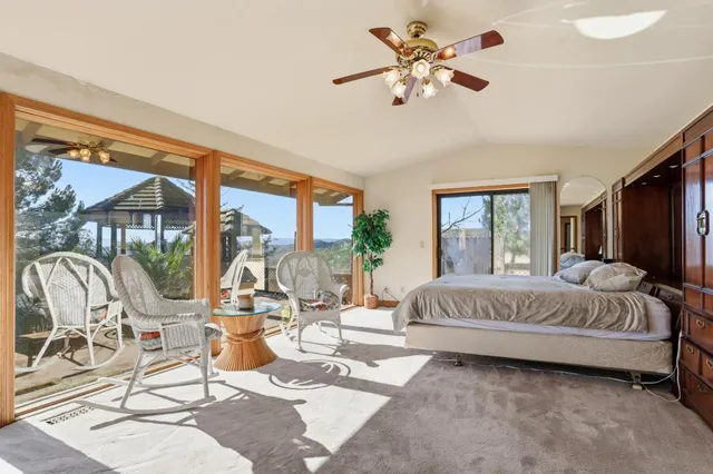 a view of a balcony with wooden floor