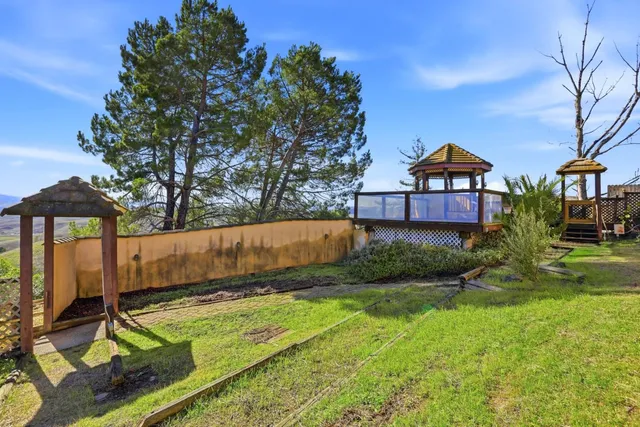 an aerial view of a house with a garden
