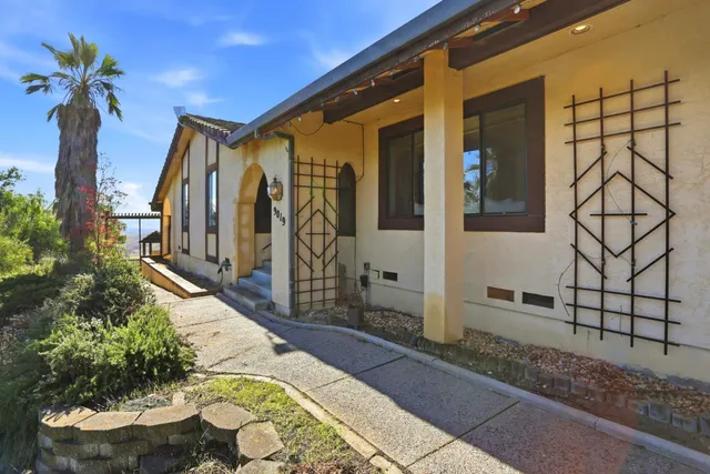 a kitchen with a stove sink and cabinets