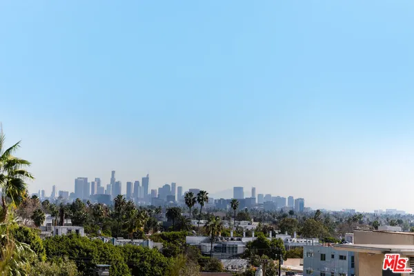 a view of a city with tall buildings in the background