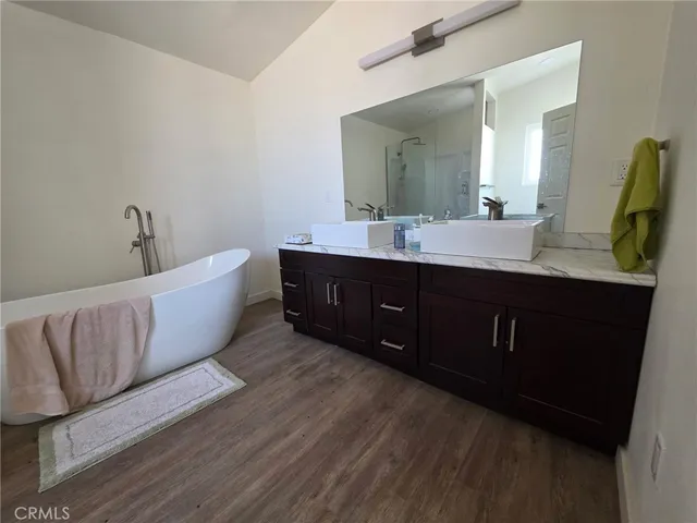 a living room with a couch and a sink