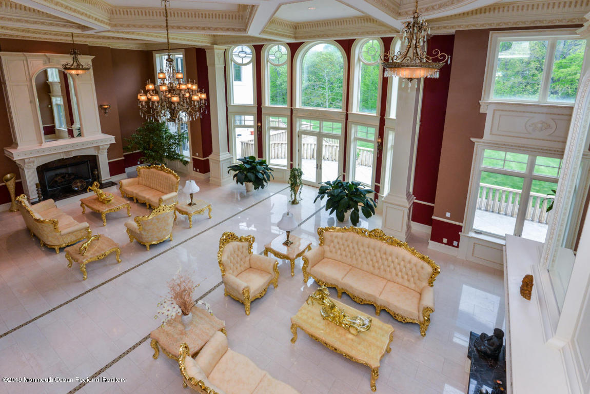8 Squan Song Lane Colts Neck, NJ 07722 - Photo 14 of 16 a living room filled with furniture and a large window