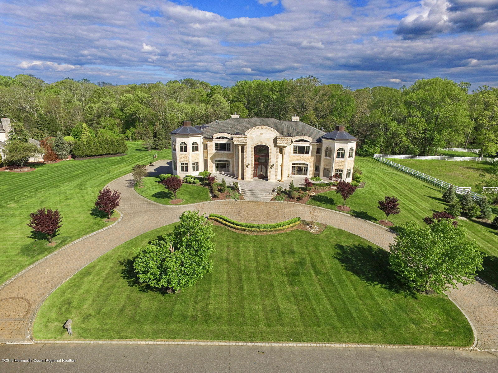 8 Squan Song Lane Colts Neck, NJ 07722 - Photo 8 of 16 a front view of a house with a yard