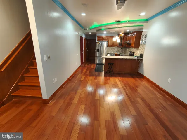 a view of kitchen and wooden floor