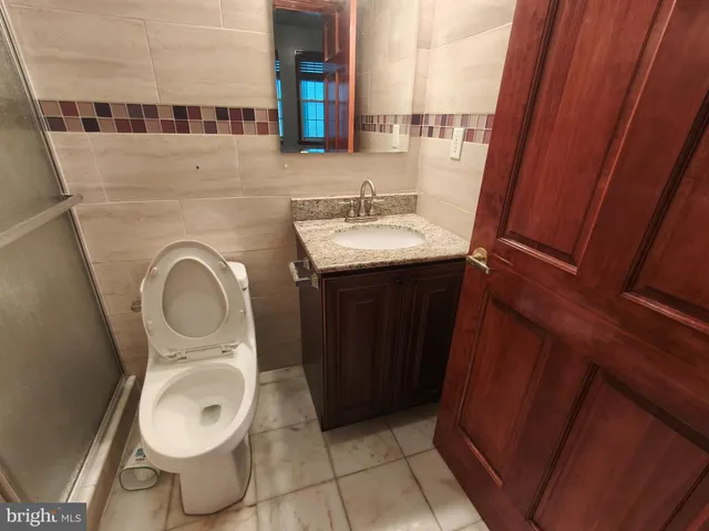 a bathroom with a toilet and a sink