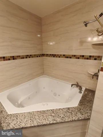 a view of a bathtub in bathroom